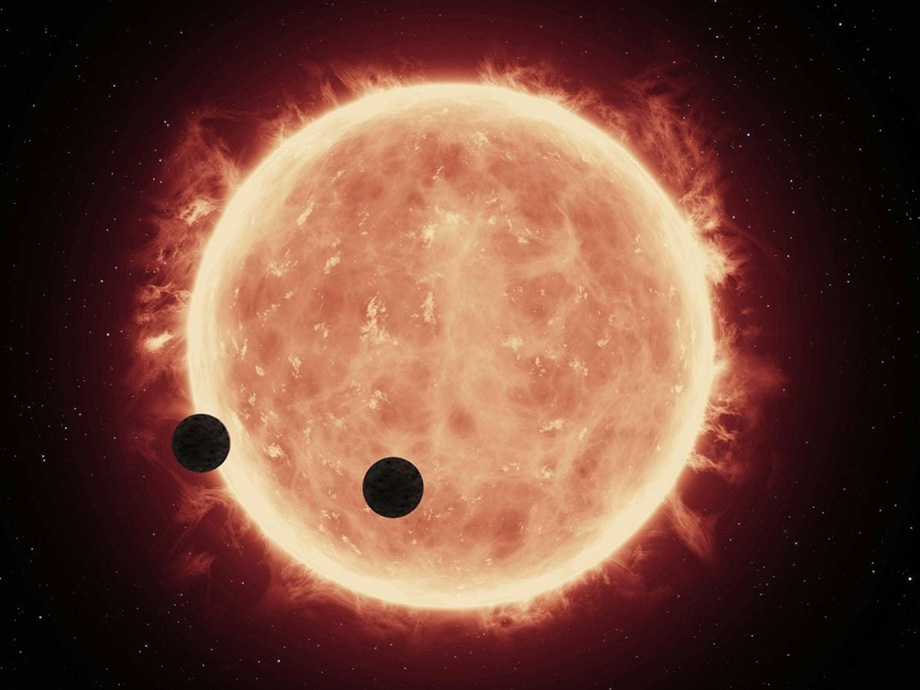 image of the sun with planets in front