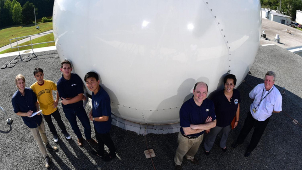 researchers standing near station